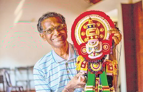 Ramesh K V with a yakshagana puppet