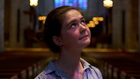 Nadia Makuc, a Catholic and Princeton University student, poses for a portrait at the university chapel after attending a service in Princeton, N.J.
