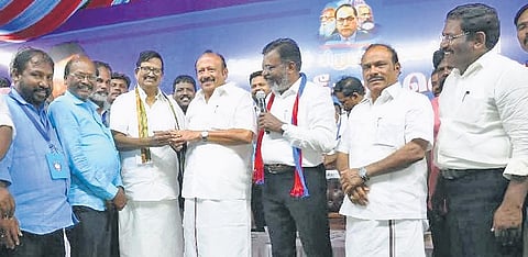 On behalf of Thirumavalavan, K S Alagiri presented a gold ring to Minister M R K Panneerselvam during the public meeting on Tuesday