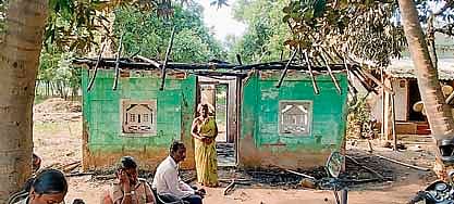 S Mallika, a Dalit victim, stands in front of her hut, which was set on fire during the clash on Monday night at Thiruvallur Nagar in Vadakadu village