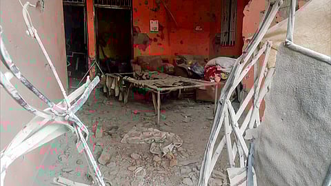 A view of a damaged civilian building due to the ceasefire violation by the Pakistan army, in Rajouri on Wednesday.