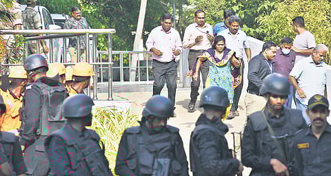 Police and disaster response force personnel during an evacuation drill at Chennai Port on Wednesday