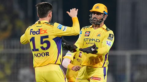 Chennai Super Kings' Noor Ahmad celebrates with captain Mahendra Singh Dhoni after the dismissal of Kolkata Knight Riders' Angkrish Raghuvanshi (Photo | AP)