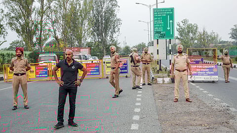 Punjab Police stand guard after the closure of Sri Guru Ramdas Ji International Airport in Amritsar on Wednesday, May 7, 2025.