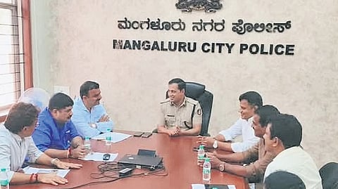 BJP leaders in conversation with Mangaluru City Police Commissioner Anupam Agrawal in Mangaluru on Thursday