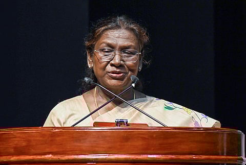 President Droupadi Murmu addresses a group of students from various Eklavya Model Residential Schools, at Rashtrapati Bhawan in New Delhi on Friday.