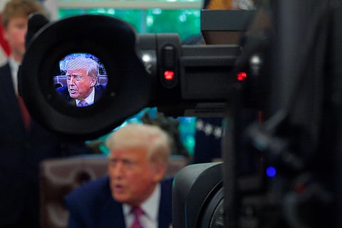 U.S. President Donald Trump talks to reporters after signing several Congressional resolutions into law in the Oval Office at the White House on May 09, 2025 in Washington, DC.