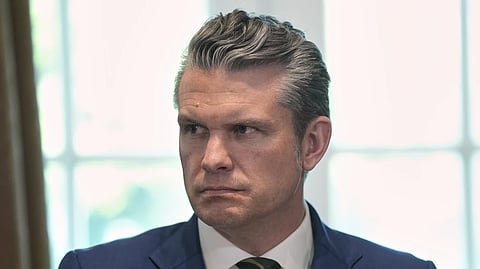 Secretary of Defense Pete Hegseth listens during a cabinet meeting at the White House, Wednesday, April 30, 2025, in Washington.