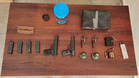The seized material include two .30 calibre pistols with four magazines, 30 live cartridges, two hand grenades, two lever detonators, remote control devices and charger, command mechanism, eight batteries, a black box, and 972 grams of RDX.