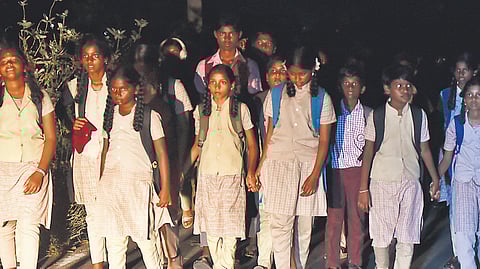 Children brave snake-infested path after school to reach home.