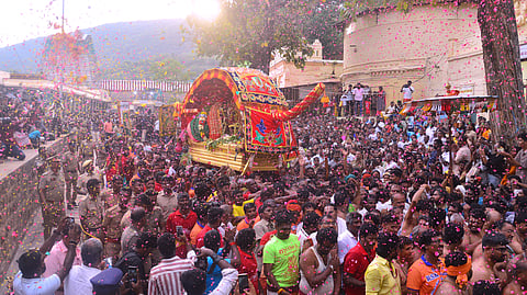 Lord Kallalagar starting annual ritual journey towards Madurai in golden palanquin to enter Vaigai river as part of Chithirai festival from Alagar temple in Alagar hills here on Saturday.