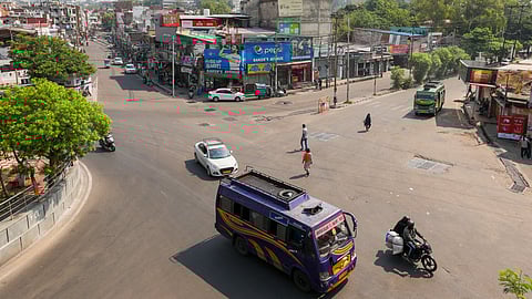 People commute as normal activities resume, a day after India and Pakistan reached a bilateral understanding, in Jammu.