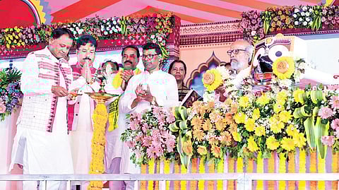 Chief Minister Mohan Charan Majhi lighting the lamp at the event.