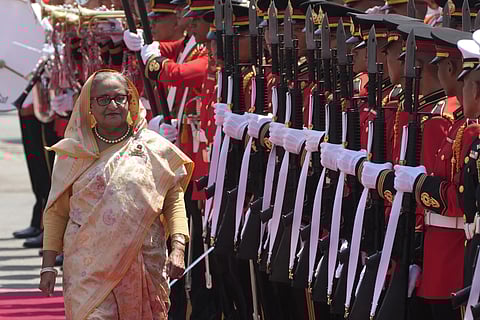 Bangladesh's Prime Minister Sheikh Hasina reviews an honour guard during a welcome ceremony at the government house in Bangkok, Thailand, Friday, April 26, 2024.
