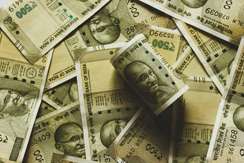Indian rupee weighed down by steady dollar demand and a cautious global mood.