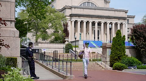 A New York City police officer keeps watch on the campus of Columbia University in New York, Monday, May 6, 2024.