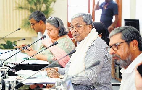 Chief Minister Siddaramaiah, flanked by senior officials, addresses a meeting of the state-level Disha Committee at Vidhana Soudha in Bengaluru on Wednesday