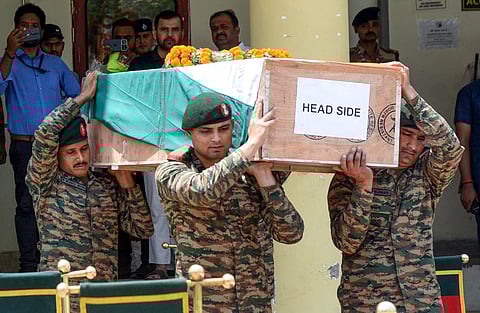 Army personnel carry the mortal remains of Army jawan Ramu Gupta upon arrival in Patna, Wednesday, May 14, 2025. Gupta was martyred in the line of duty in Jammu.