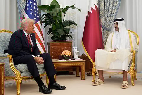 US President Donald Trump and Qatar's Emir Sheikh Tamim bin Hamad Al Thani meet at the Amiri Diwan in Doha, Qatar, Wednesday, May 14, 2025.