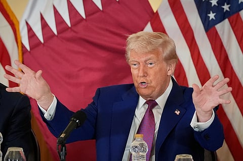 President Donald Trump gestures during a business roundtable, Thursday, May 15, 2025, in Doha, Qatar.