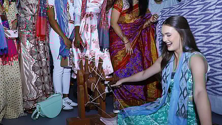 A contestant tries her hand at a charkha in Pochampally on Thursday