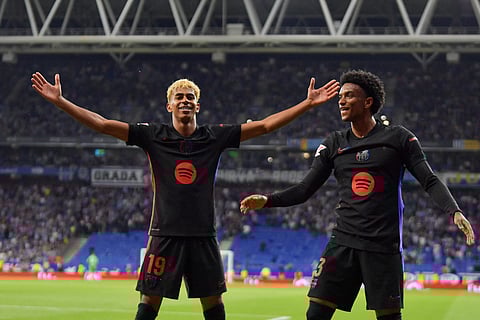 Barcelona's Spanish forward #19 Lamine Yamal celebrates scoring his team's first goal next to teammate Barcelona's Spanish defender #03 Alex Balde (Photo | AFP)
