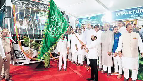 Chief Minister A Revanth Reddy flags off a bus carrying Haj pilgrims from Haj House in Hyderabad on Friday