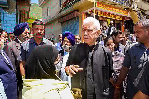 Lt Governor of Jammu & Kashmir Manoj Sinha interacts with people during a visit to an area affected by the recent shelling from Pakistan.