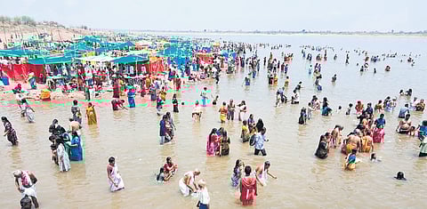 Devotees take holy dips on the third day of Saraswati Pushkaralu at Triveni Sangam in Kaleshwaram on Saturday