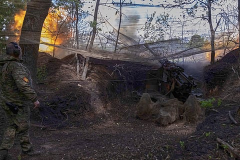 Ukrainian servicemen of the 127th Territorial Defence Brigade fire KS-19 100mm gun towards Russian positions near Kharkiv, Ukraine, Friday, May 16, 2025