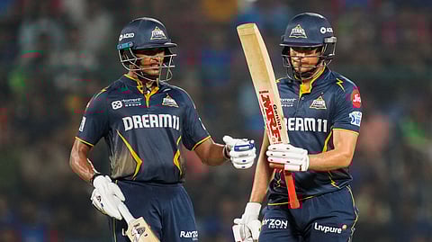 Gujarat Titans' captain Shubman Gill celebrates his half century with Sai Sudharsan during an Indian Premier League (IPL) 2025 T20 cricket match between Delhi Capitals and Gujarat Titans, at the Arun Jaitley Stadium, in New Delhi, Sunday, May 18, 2025.
