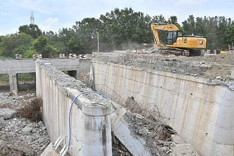 The demolition of the old bridge near Kuniyamuthur is under way
