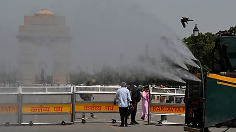 Anti-smog guns being used to spray water droplets to curb air pollution, in New Delhi.