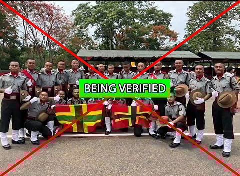 Twenty-one men are seen in the viral photograph holding a couple of flags, allegedly that of militant group Zomi Revolutionary Army.