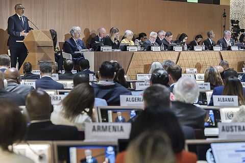 Director General of the World Health Organization (WHO) Tedros Adhanom Ghebreyesus, left, delivers his statement, during the opening of the 78th World Health Assembly at the European Headquarters of the United Nations in Geneva, Switzerland, Monday, May 19, 2025.