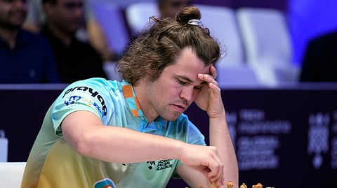 Norwegian chess grandmaster Magnus Carlsen was forced into a draw Monday by more than 143,000 people worldwide playing against him in a single.