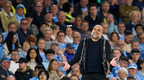 Manchester City's head coach Pep Guardiola reacts during the English Premier League soccer match.