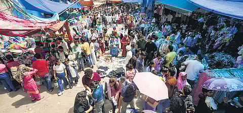 Sarojini Nagar shopkeepers use tarpaulin for shade after encroachment removal.