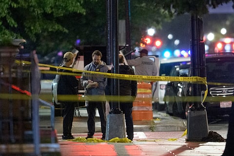 Law enforcement work the scene after two staff members of the Israeli Embassy in Washington were shot and killed outside the Capital Jewish Museum, Thursday, May 22, 2025, in Washington.