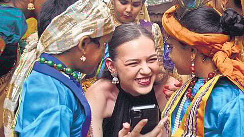 A Miss World contestant interacts with kids at Shilparamam in Madhapur, Hyderabad on Thursday.
