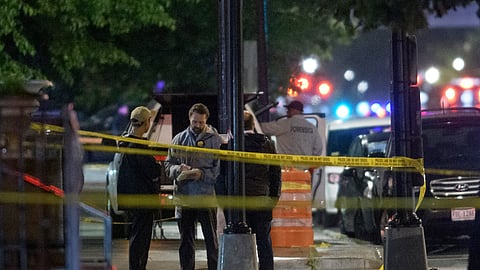 Law enforcement work the scene after two staff members of the Israeli Embassy in Washington were shot and killed outside the Capital Jewish Museum, Thursday, May 22, 2025, in Washington.