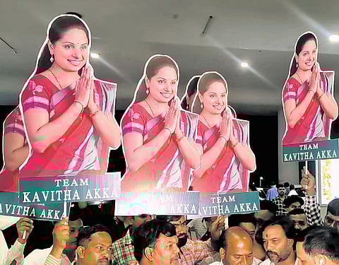 Supporters of MLC K Kavitha carry ‘Team Kavitha Akka’ placards as a beaming BRS leader emerges from the Rajiv Gandhi International Airport in Hyderabad on Friday
