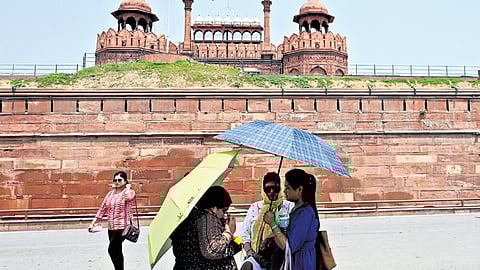 Visitors at the Red Fort during a hot summer day on Friday