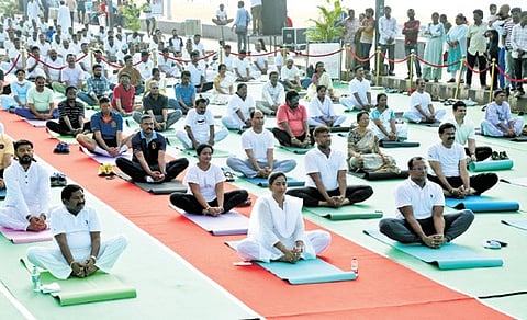 Home minister Vangalapudi Anitha, Visakhapatnam district incharge minister Dola Sree Bala Veeranjaneya Swamy, collector MN Harendhira Prasad, other officials and public in huge numbers take part in a yoga session held on the RK Beach road in Visakhapatnam on Saturday.