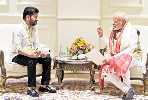 Chief Minister A Revanth Reddy is all ears as Prime Minister Narendra Modi makes a point during their one-on-one meeting in New Delhi on Saturday.