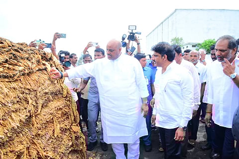 Ministers K Atchannaidu, G Ravi Kumar visited tobacco barns and interacted with farmers and tobacco buyers in Parchur in Bapatla district on Saturday.