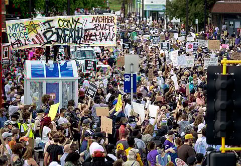 FILE - Protesters gather, calling for justice for George Floyd, on Tuesday, May 26, 2020, in Minneapolis.