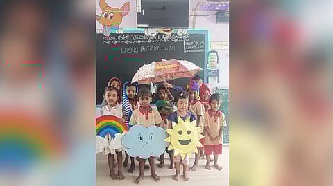 Kids with the craft works of sun, clouds and rainbows at the Anganwadi centre in Virudhunagar.