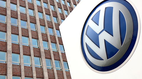 In this April 13, 2018, photo, Volkswagen logo is pictured in front of a company building in Wolfsburg, Germany.
