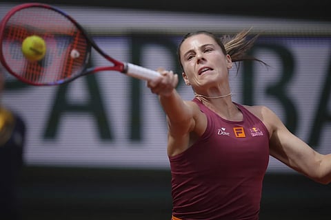 Emma Navarro of the US returns the ball to Spain's Jessica Bouzas Maneiro during their first round match of the French Tennis Open, at the Roland-Garros Stadium, in Paris, Monday, May 26, 2025.
